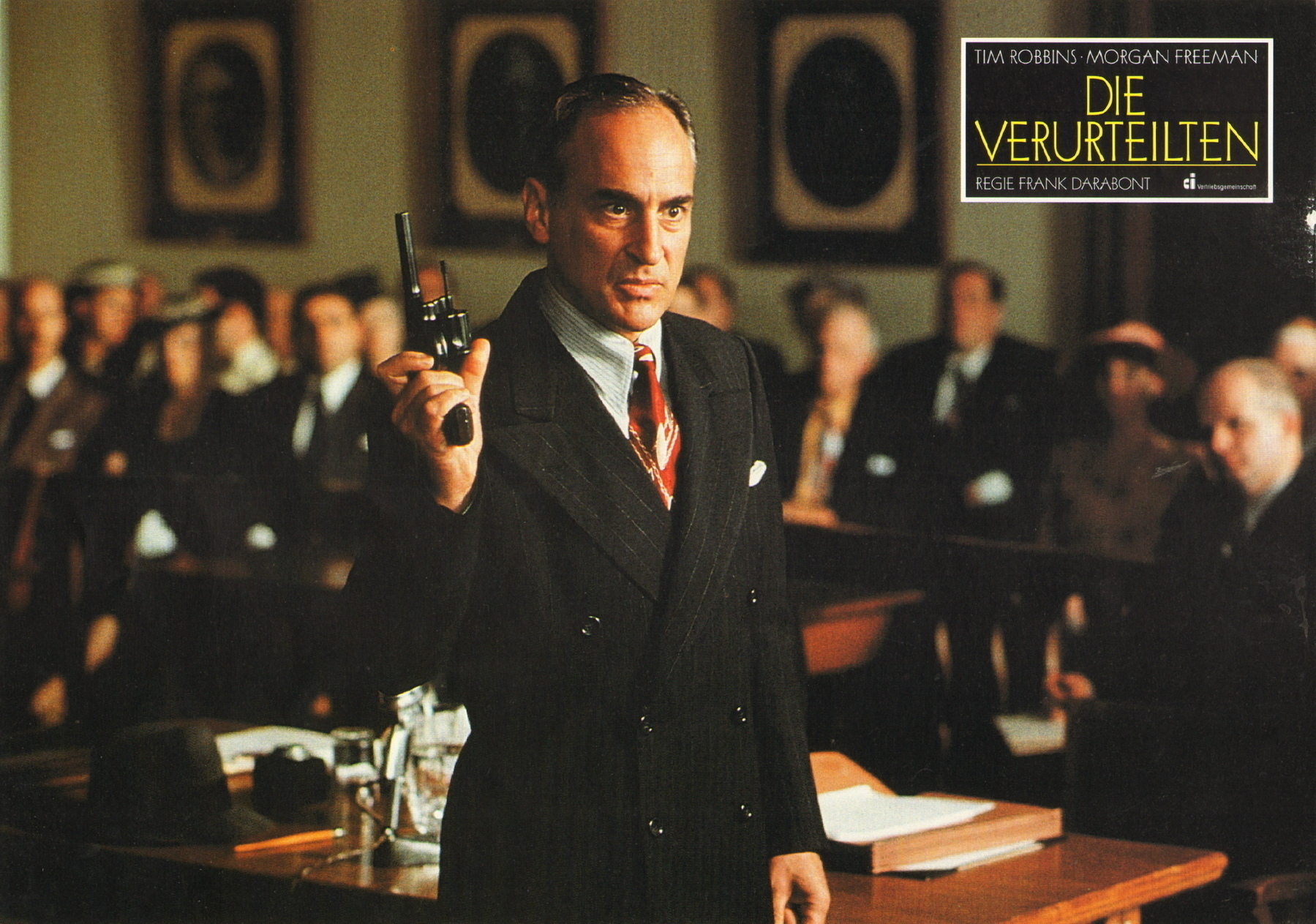 Lawyer holding a gun in a court room. 