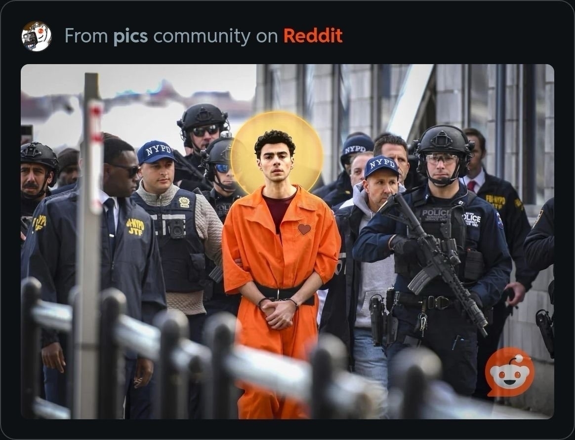 Man in orange suit with a hallow superimposed on him. Armed military surround him as he walks.