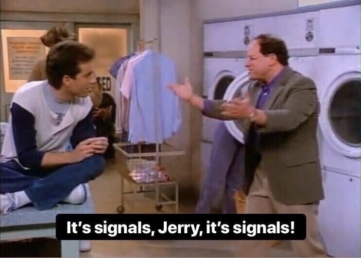 Still of pilot episode of Seinfeld. George is saving his hands at Jerry. "It's signals Jerry, it's signals"