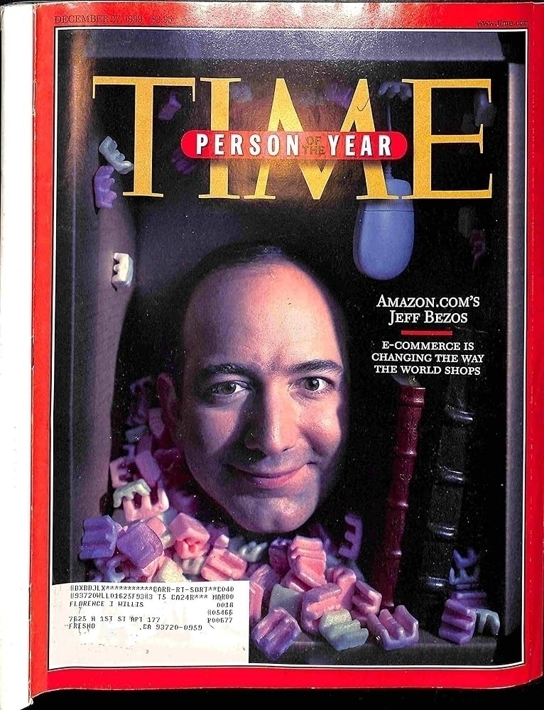 Time Person of the year cover: Jeff Bezos poking his head out what appears to be a pile of letters and books. 