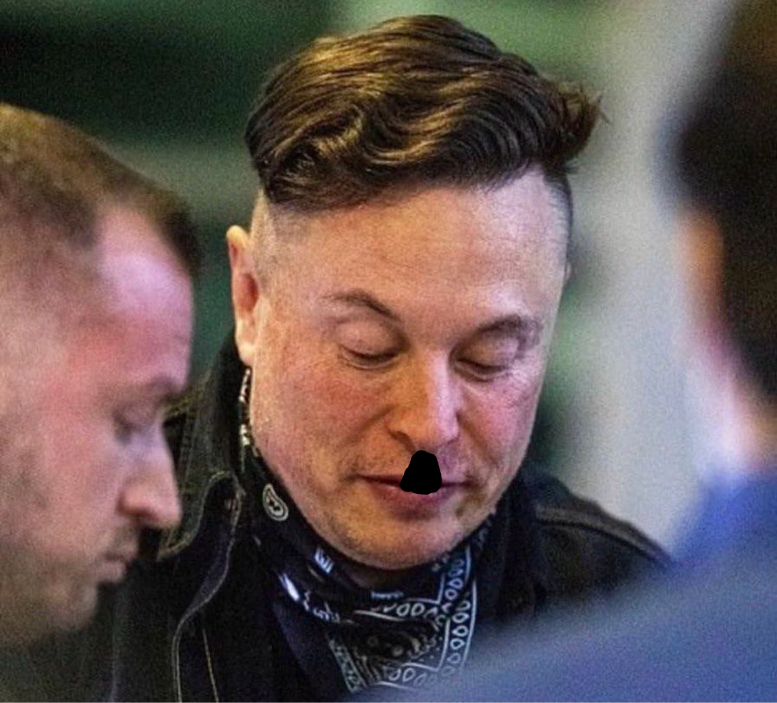 Elon Musk with that ridiculous haircut and a black smuge on his upper lip