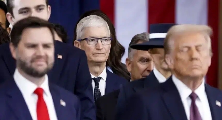 Apple CEO Tim Cook standing behind Trump and Vance at Trump's inauguration. 