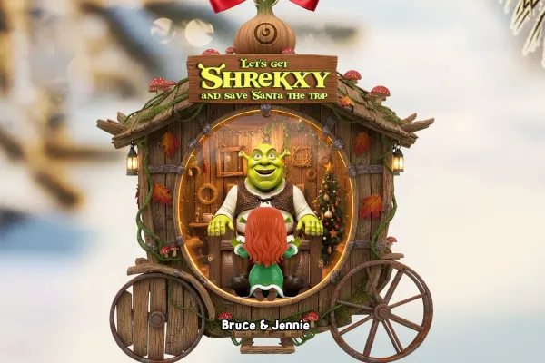 Shrek sitting on a chair in a wooden buggy with what appears to be Fiona kneeling in front of him. 
